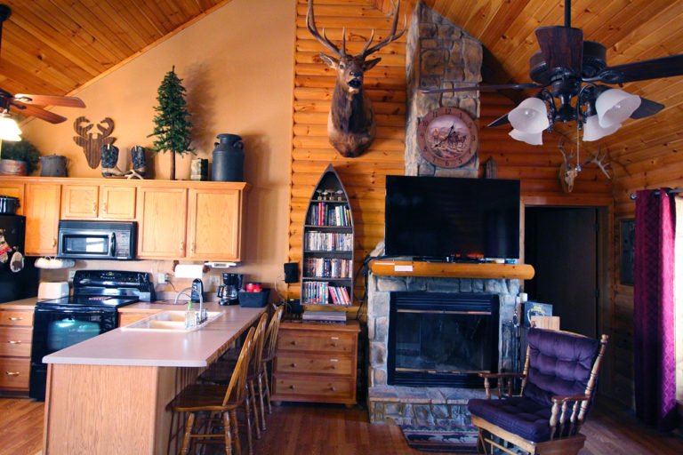 View of Fireplace and Kitchen Old West Log Cabin
