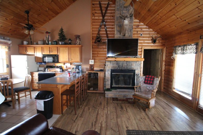 Kitchen and Fireplace Trappers Den Log Cabin