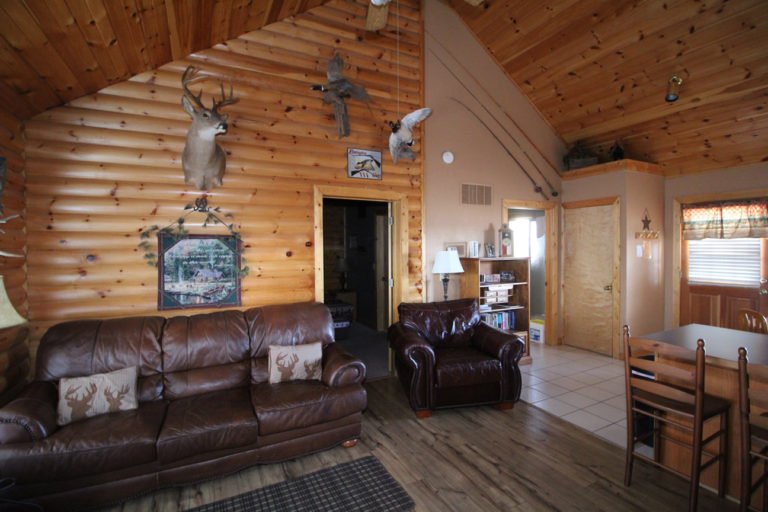 Couches and Recliner in the Living Area Trappers Den Log Cabin