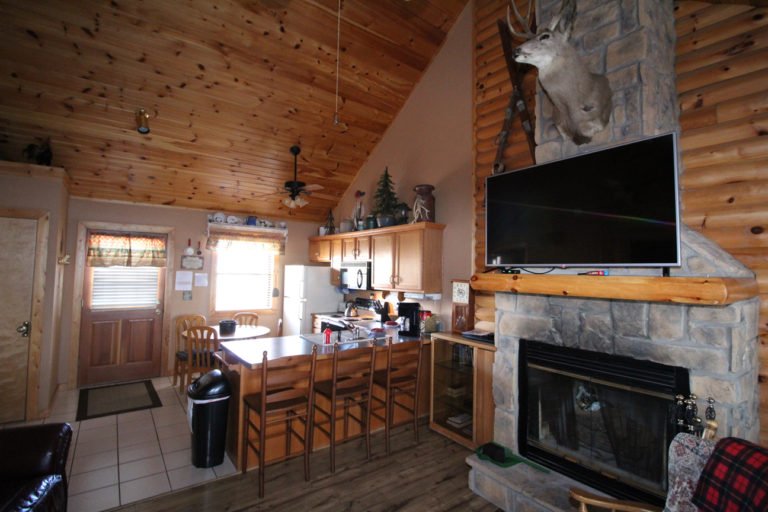 View to the Kitchen From Living Area Trappers Den Log Cabin