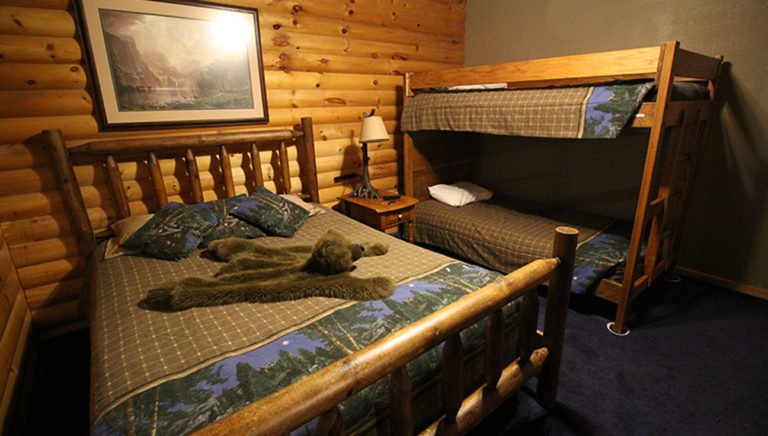 Guest Bedroom With Queen Size Bed and Bunk Beds Split Oak Log Cabin