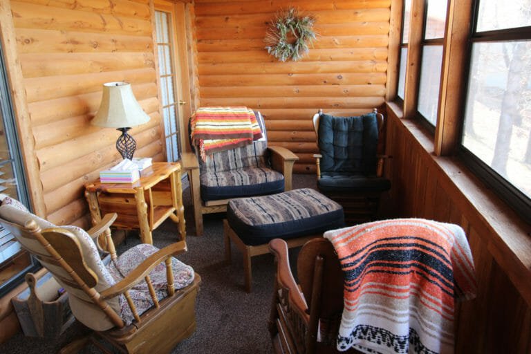 Back Porch Trappers Den Log Cabin